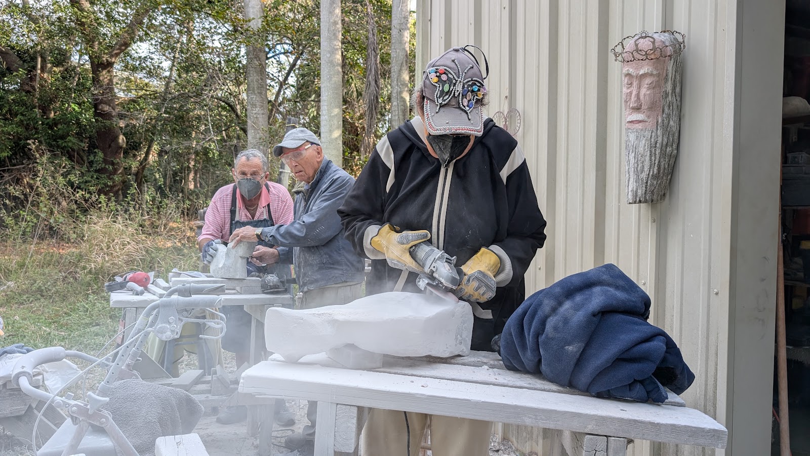 Paul Cummings working on stone sculpture at Green Cay Art Studio